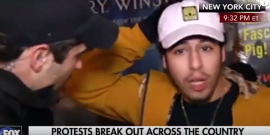 Anti-Trump protester yell "grab her by the p*ssy" during live interview article image