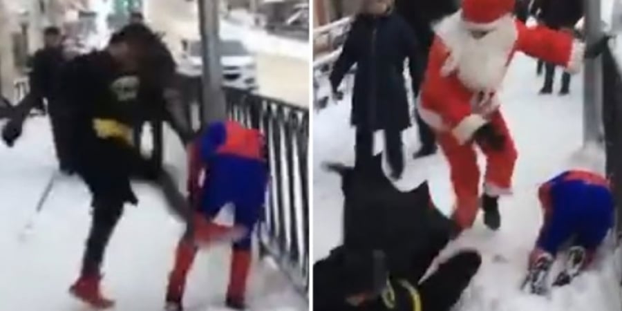 Guy dressed as Batman beats up Spiderman before Santa steps in to save the day article image