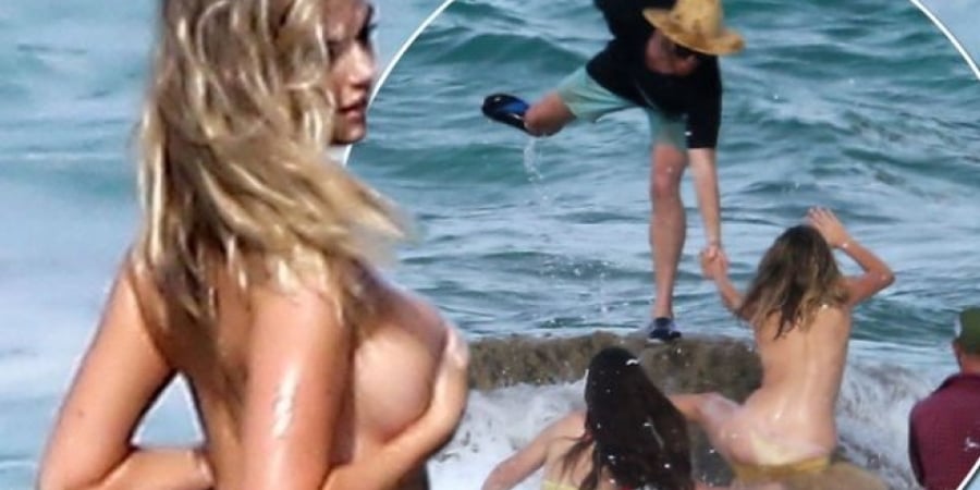 Kate Upton gets swept off a rock during topless photoshoot article image